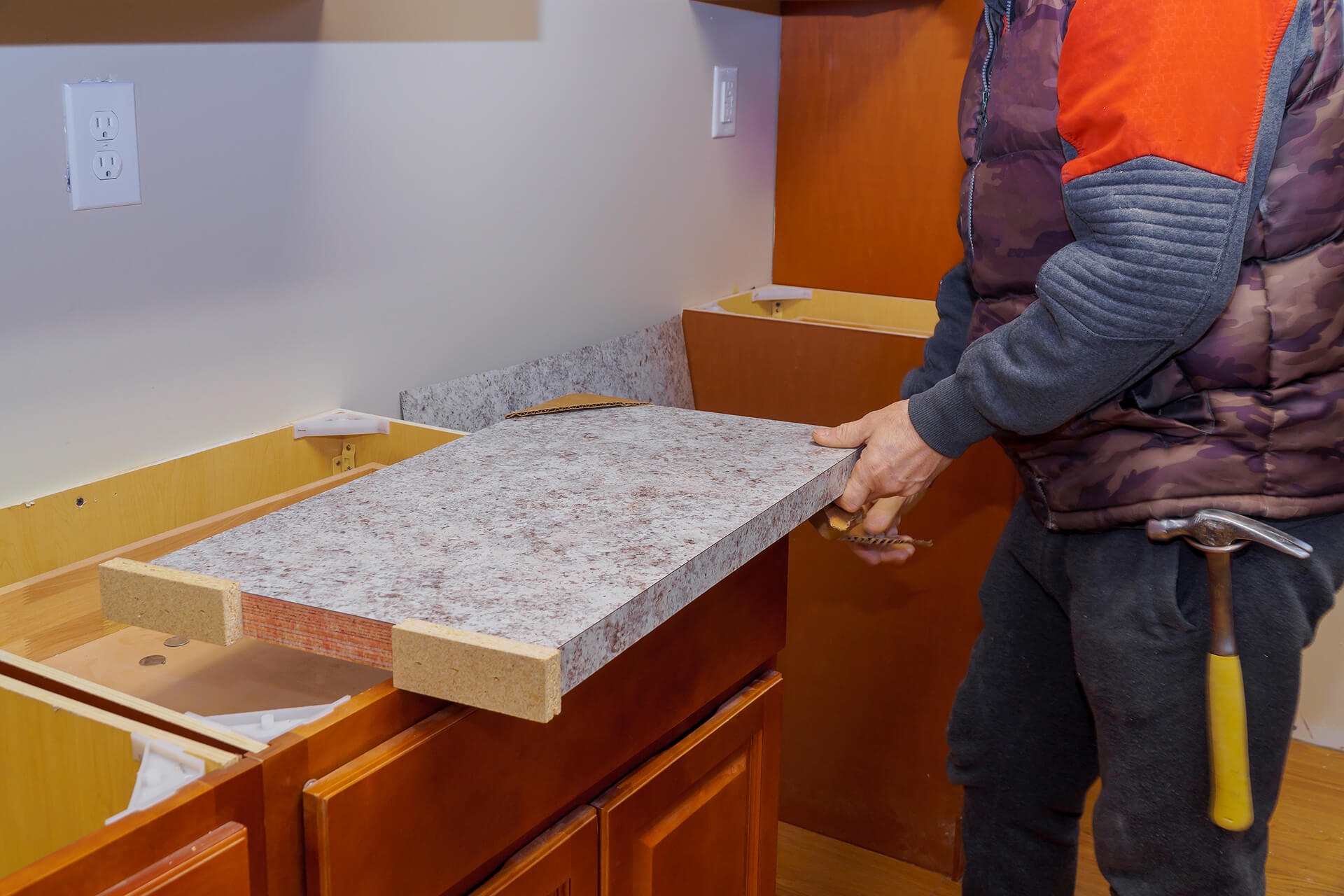 Midsection carpenter working kitchen