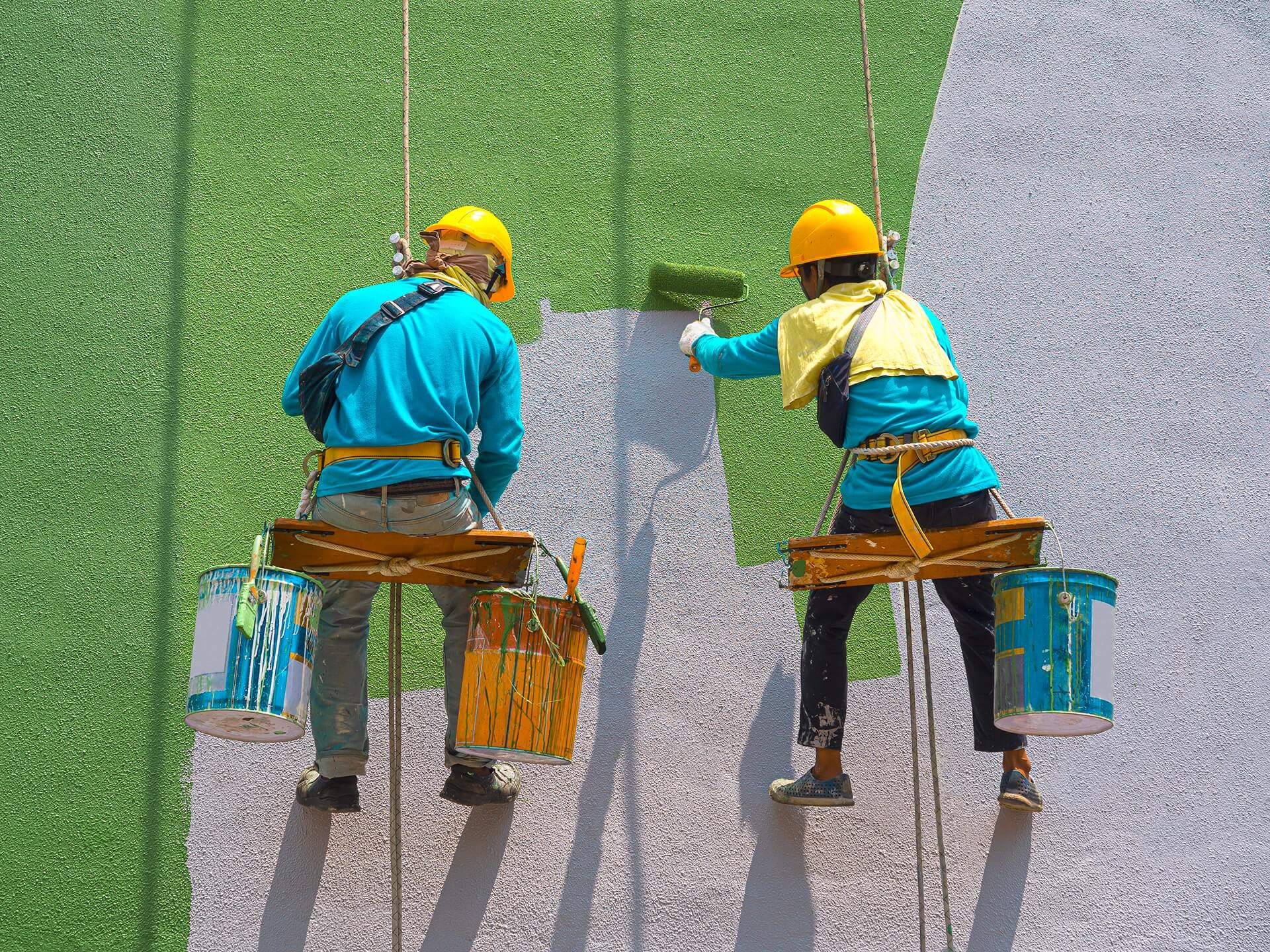 Painters painting exterior building