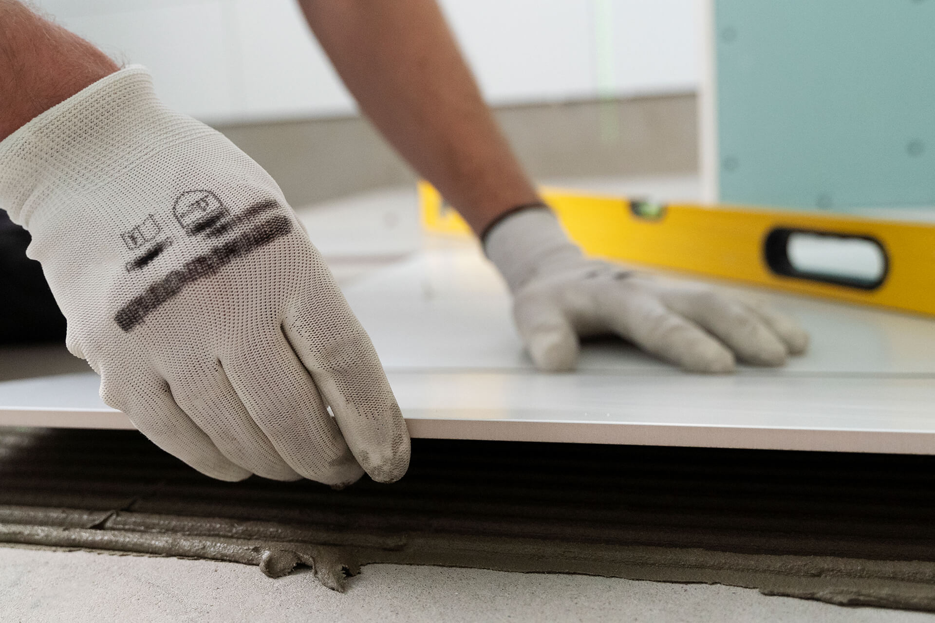 Tiler working renovation apartment