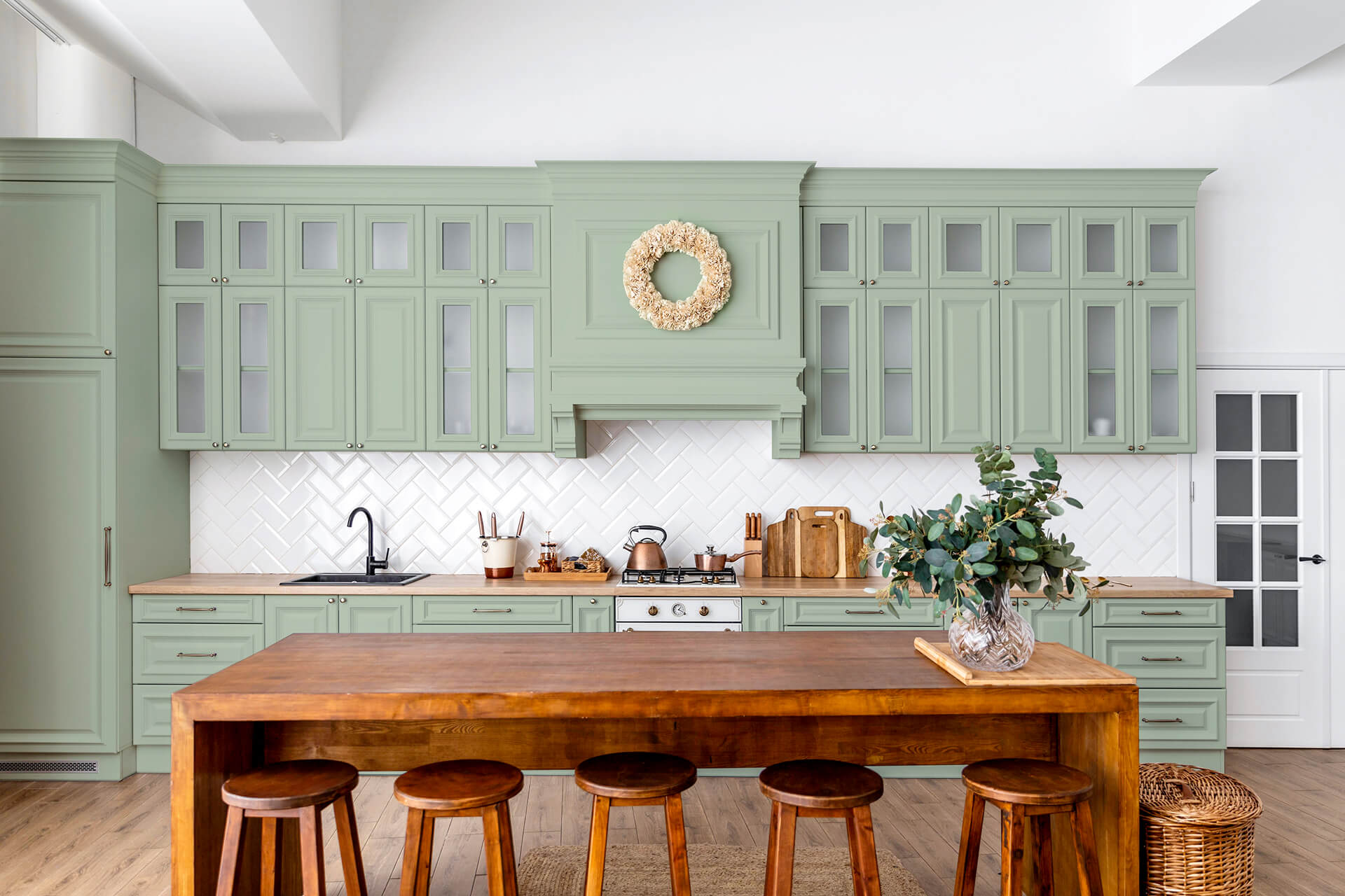 View beautifully decorated green kitchen